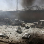 Damaged cars are seen after a blast at the site of the incident in Kabul, Afghanistan