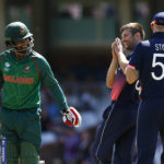 England's Mark Wood with Bangladesh's Tamim Iqbal