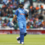 India's Virat Kohli walks off dejected after losing his wicket