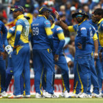 Sri Lanka's Nuwan Pradeep (R) celebrates with teammates after taking the wicket of India's Virat Kohli (not pictured)