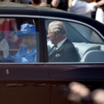 Queen Elizabeth and Prince Charles are driven to the Palace of Westminster for the State Opening of Parliament in central London